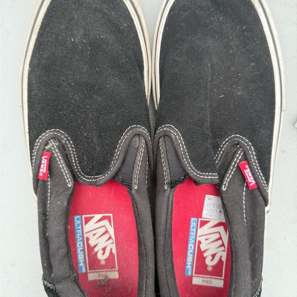Vans Black Slip-On Sneakers with Red Accents